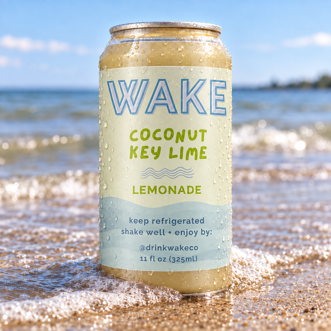 Cold WAKE Coconut Key Lime Lemonade can standing in the Lake Erie surf