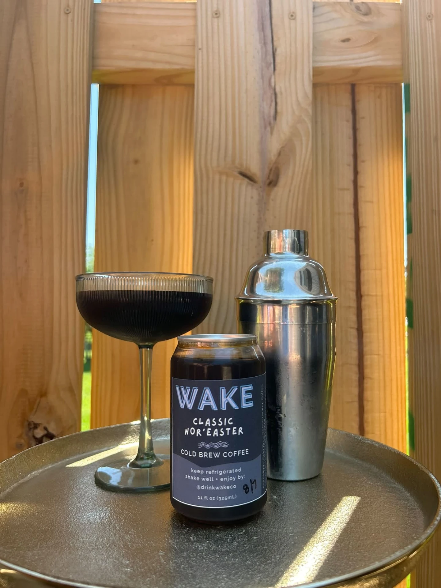 Classic Nor'easter can with a coupe glass and cocktail shaker