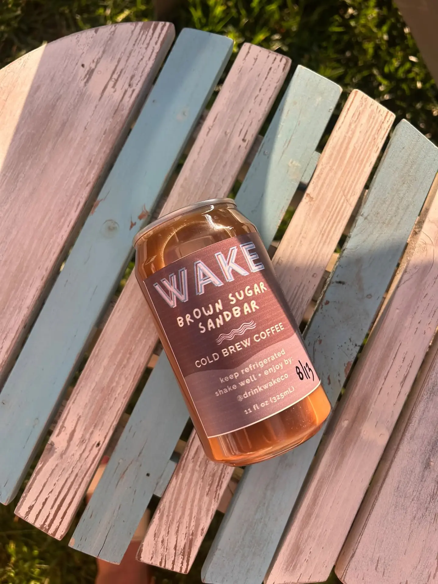 Brown Sugar Sandbar can on a weathered Adirondack chair